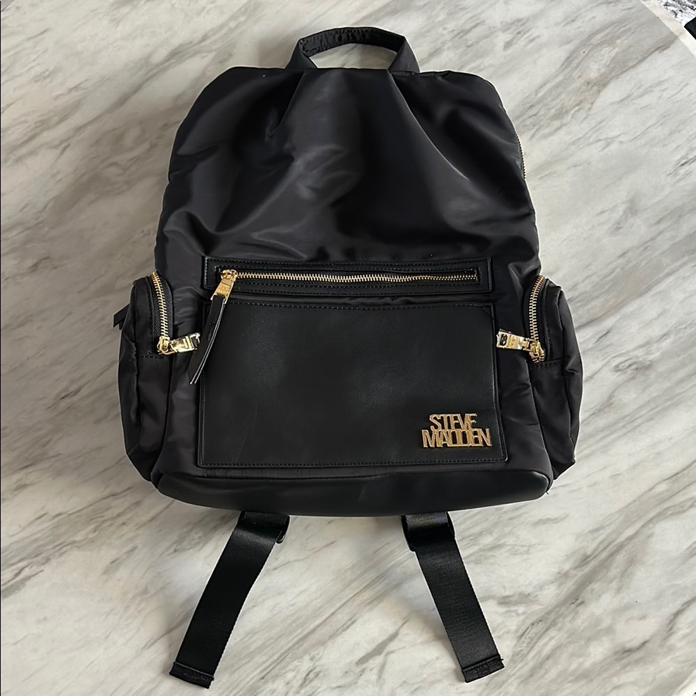 Steve Madden Black and Gold Backpack with Sophisticated Design